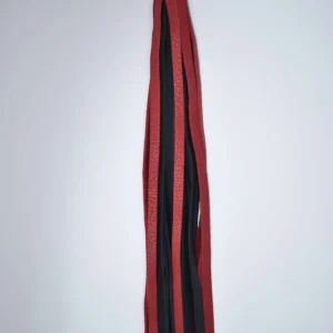 Red and Black bullhide leather swivel flogger with long flat falls and finger loop handle on white background